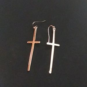 Long cross earrings.